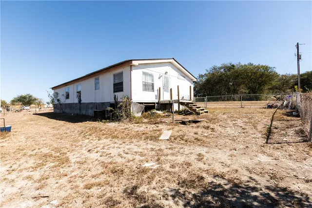 a kitchen with stainless steel appliances a sink stove top oven and cabinets