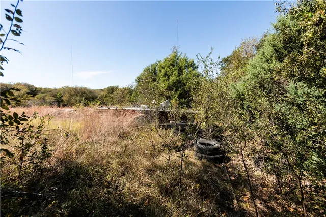 a view of outdoor space with deck and car parked