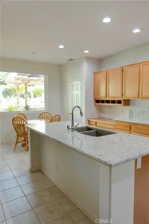 a kitchen with a sink and a large window