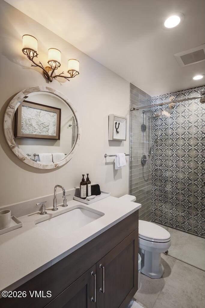 1670 Fallridge Place, Unit 9 Vail, CO 81657 - Photo 25 of 39 a bathroom with a sink a toilet and shower