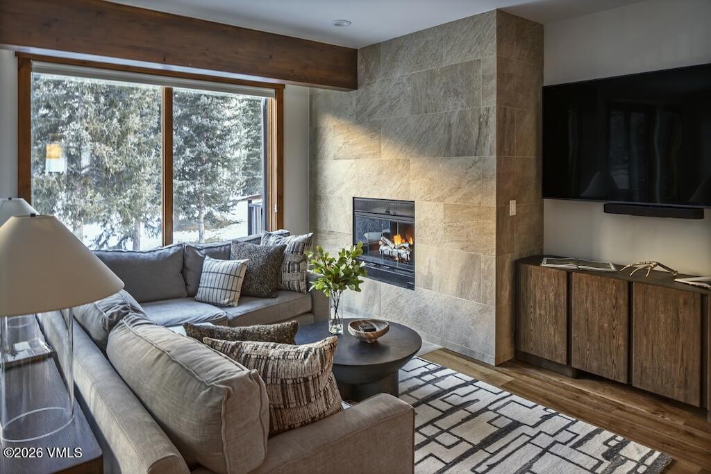 1670 Fallridge Place, Unit 9 Vail, CO 81657 - Photo 3 of 39 a living room with furniture and a fireplace