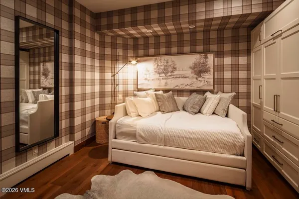 a view of a room with wooden walls