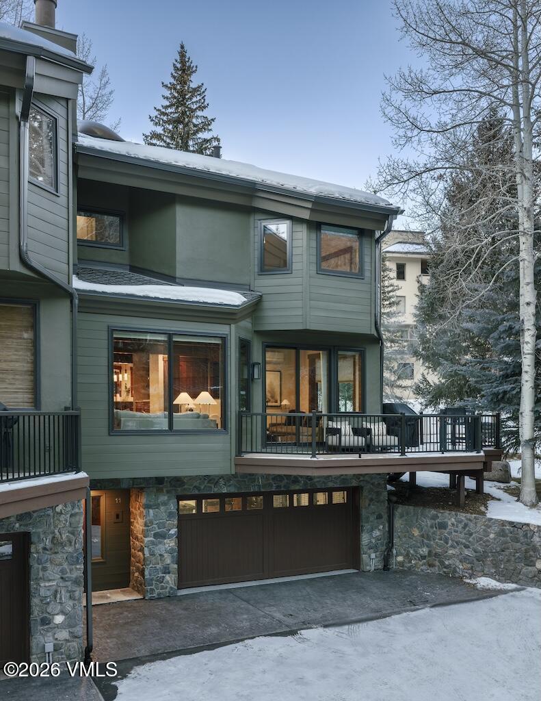 1670 Fallridge Place, Unit 9 Vail, CO 81657 - Photo 38 of 39 a front view of a building with a garden