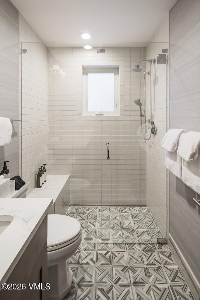 1670 Fallridge Place, Unit 9 Vail, CO 81657 - Photo 5 of 39 a bathroom with a sink a toilet and shower