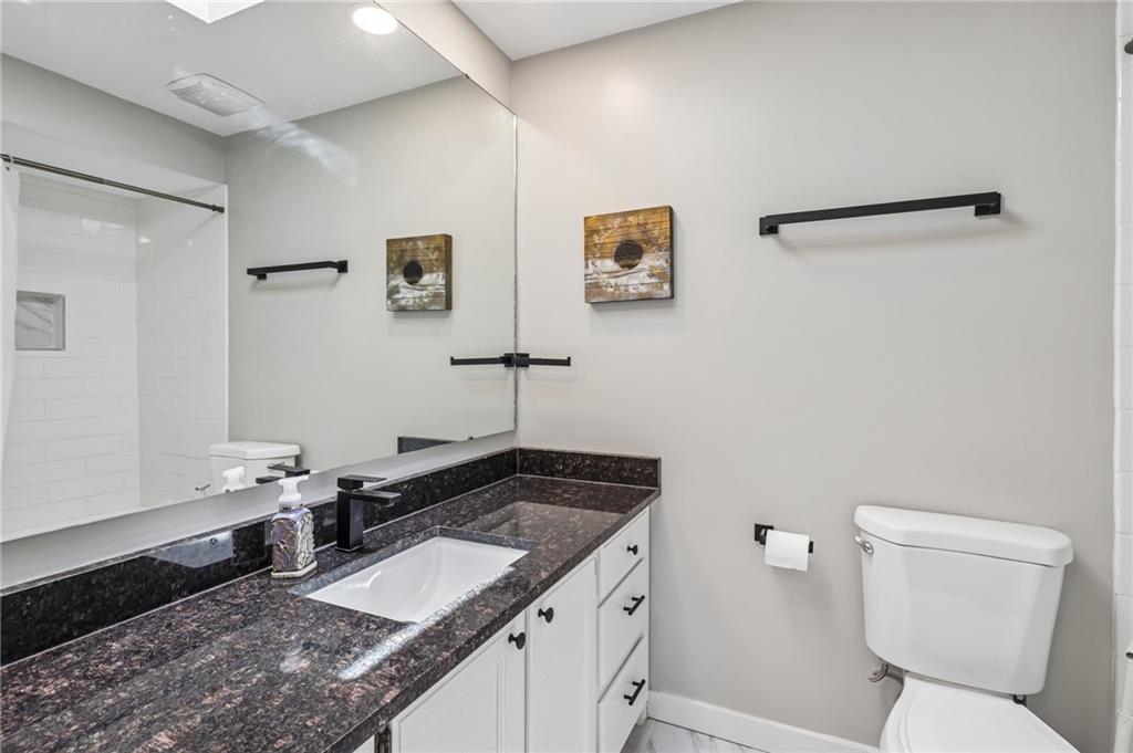 2772 Clearview Road Allison Park, PA 15101 - Photo 24 of 43 a bathroom with a granite countertop sink and a mirror