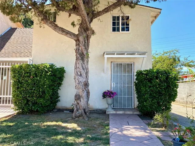 a view of a house with a street