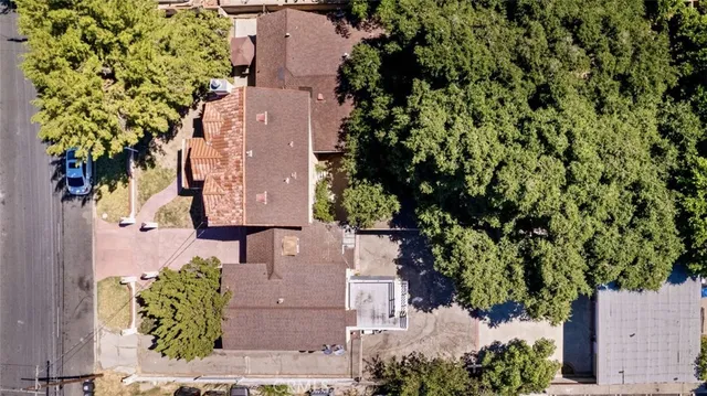 a view of an outdoor space with a table and chairs under an umbrella