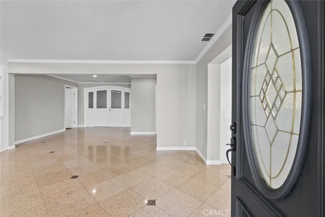 a view of a livingroom with furniture and mirror