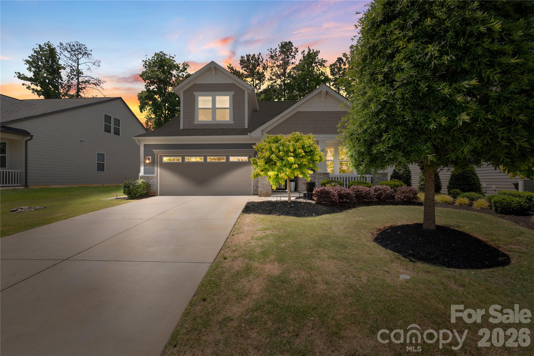 445 Sandbar Point Clover, SC 29710 - Photo 1 of 48 a front view of a house with a yard and a garden