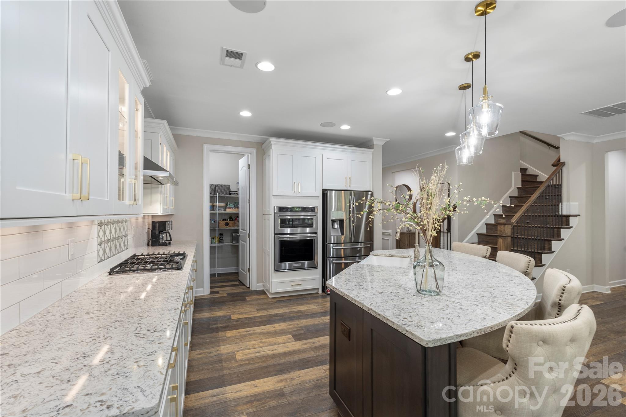 445 Sandbar Point Clover, SC 29710 - Photo 11 of 48 a kitchen with stainless steel appliances granite countertop a sink and cabinets