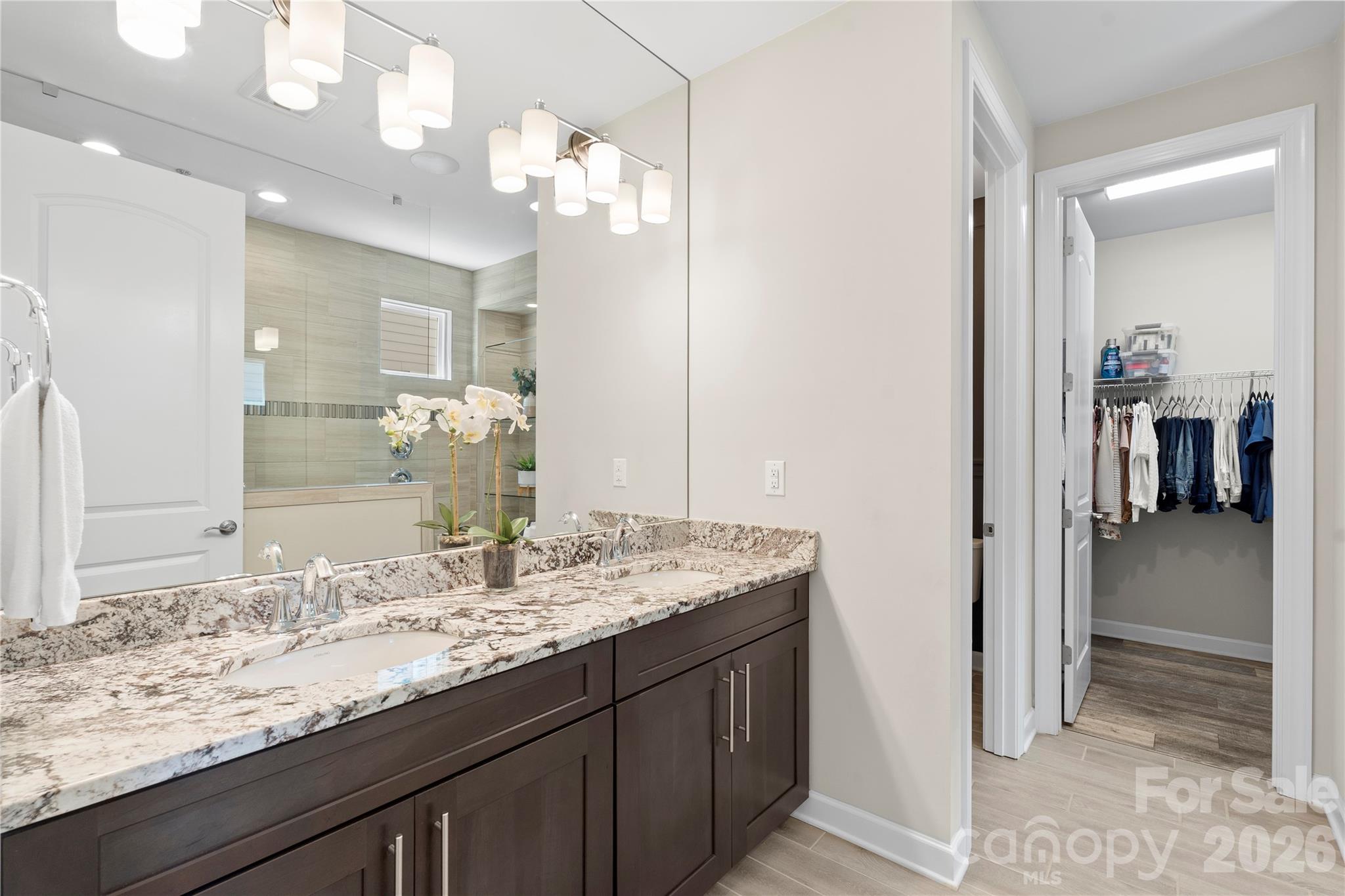 445 Sandbar Point Clover, SC 29710 - Photo 25 of 48 a bathroom with a sink and a mirror