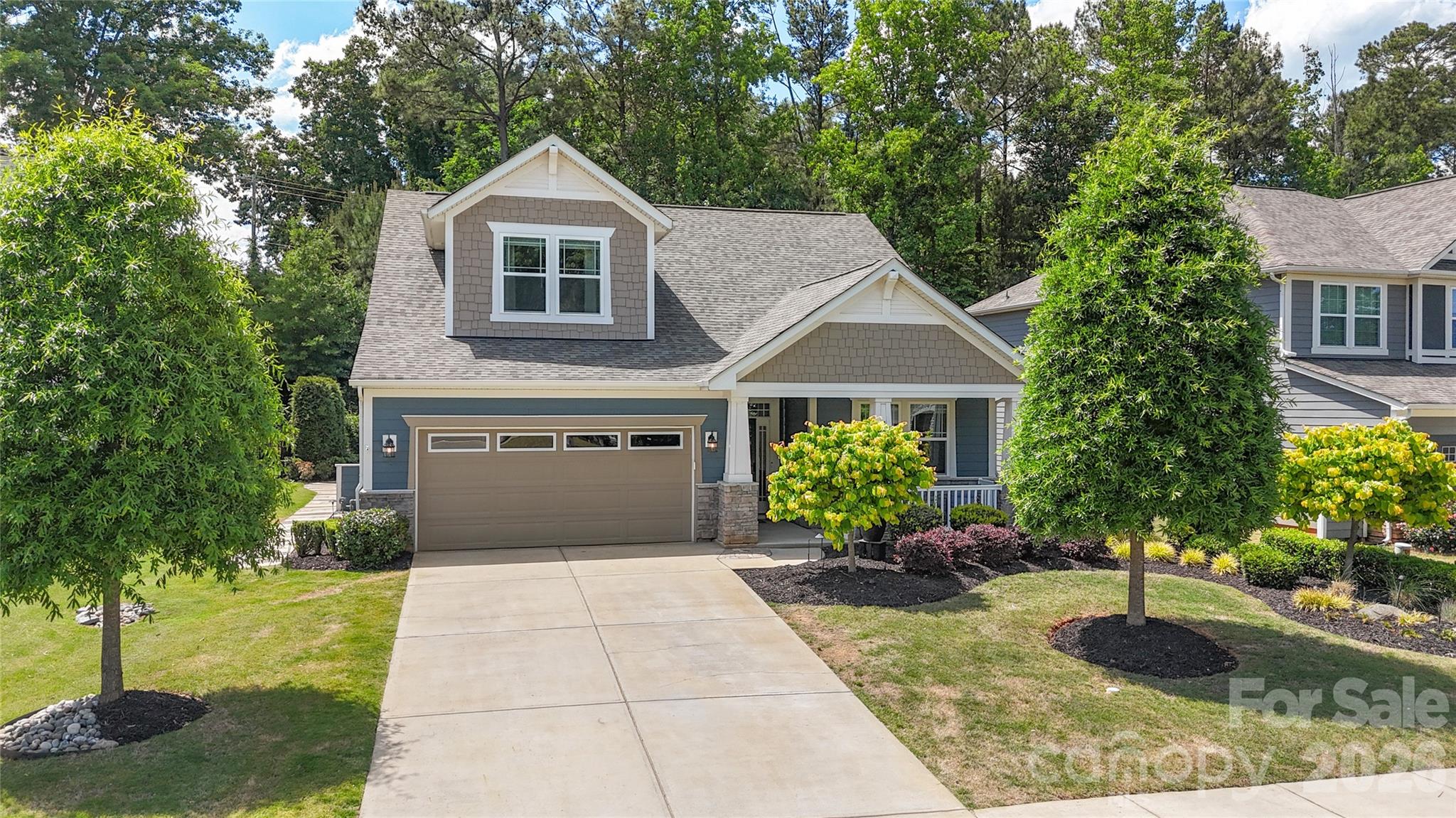 445 Sandbar Point Clover, SC 29710 - Photo 3 of 48 a front view of a house with garden