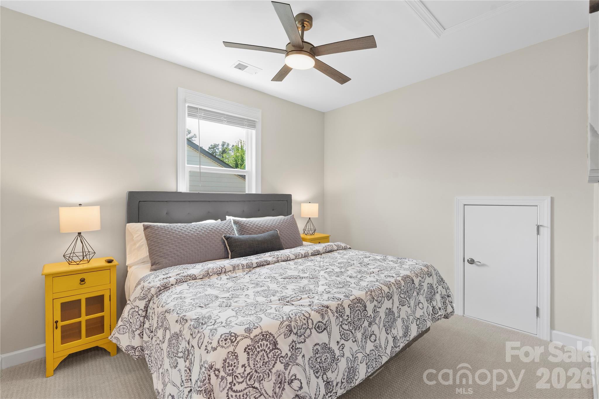 445 Sandbar Point Clover, SC 29710 - Photo 37 of 48 a bedroom with a bed and a chandelier