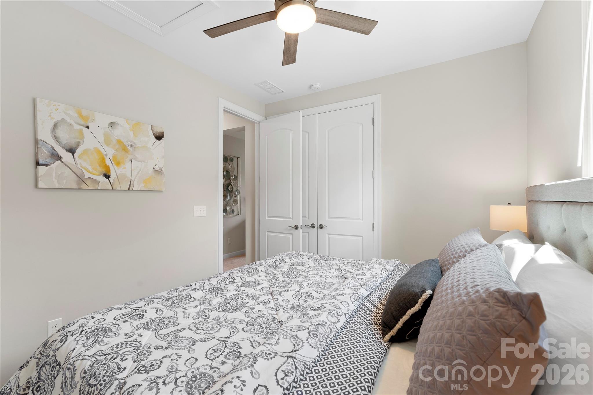 445 Sandbar Point Clover, SC 29710 - Photo 38 of 48 a bedroom with a bed and a chandelier