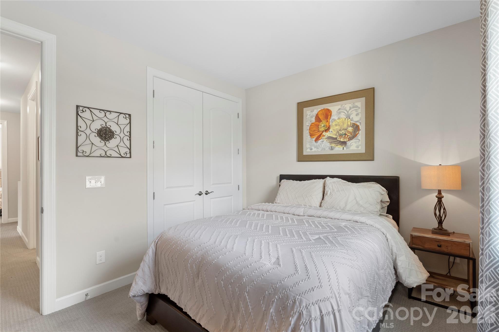 445 Sandbar Point Clover, SC 29710 - Photo 40 of 48 a bedroom with a bed and a painting on the wall