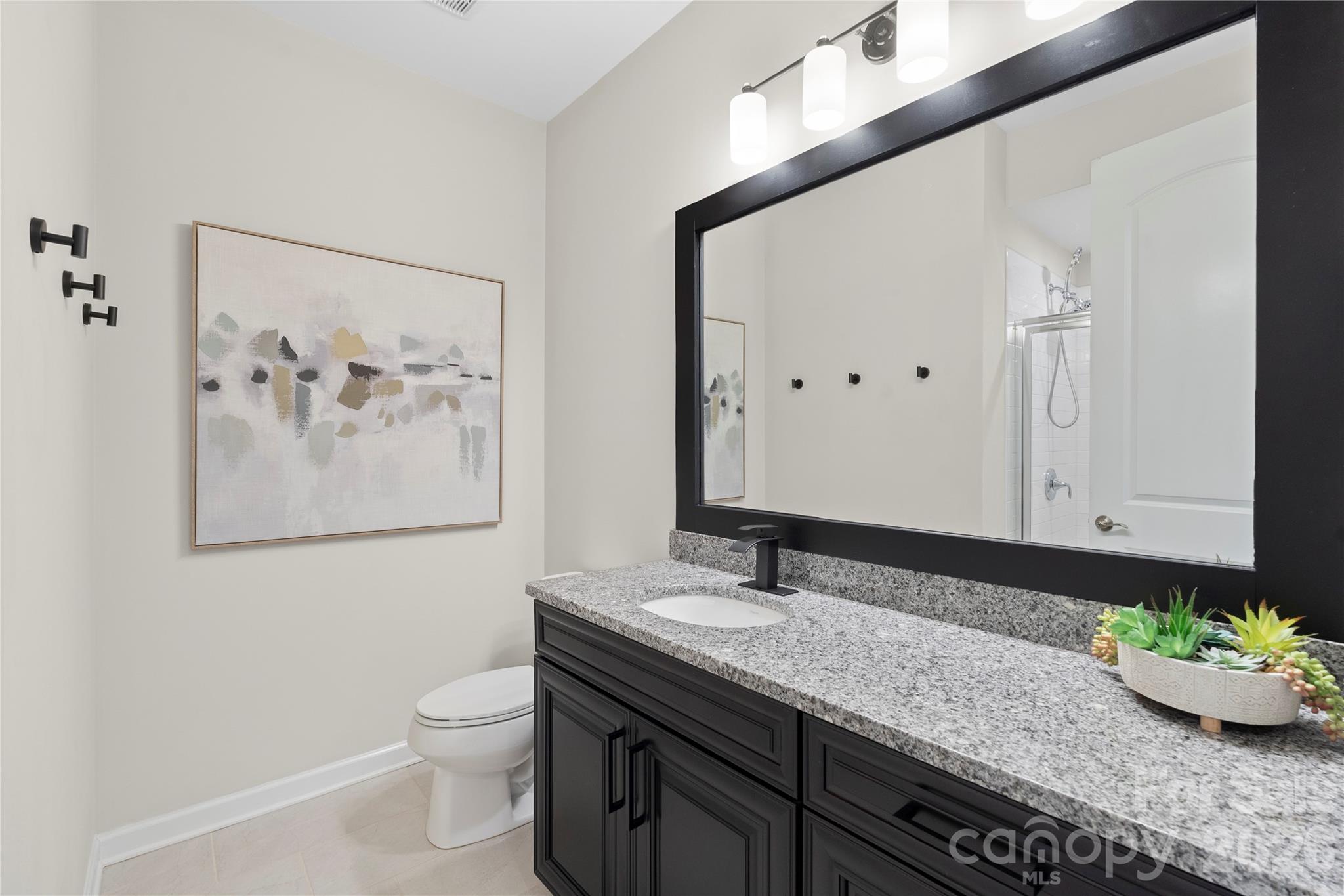 445 Sandbar Point Clover, SC 29710 - Photo 41 of 48 a bathroom with a granite countertop sink and a mirror