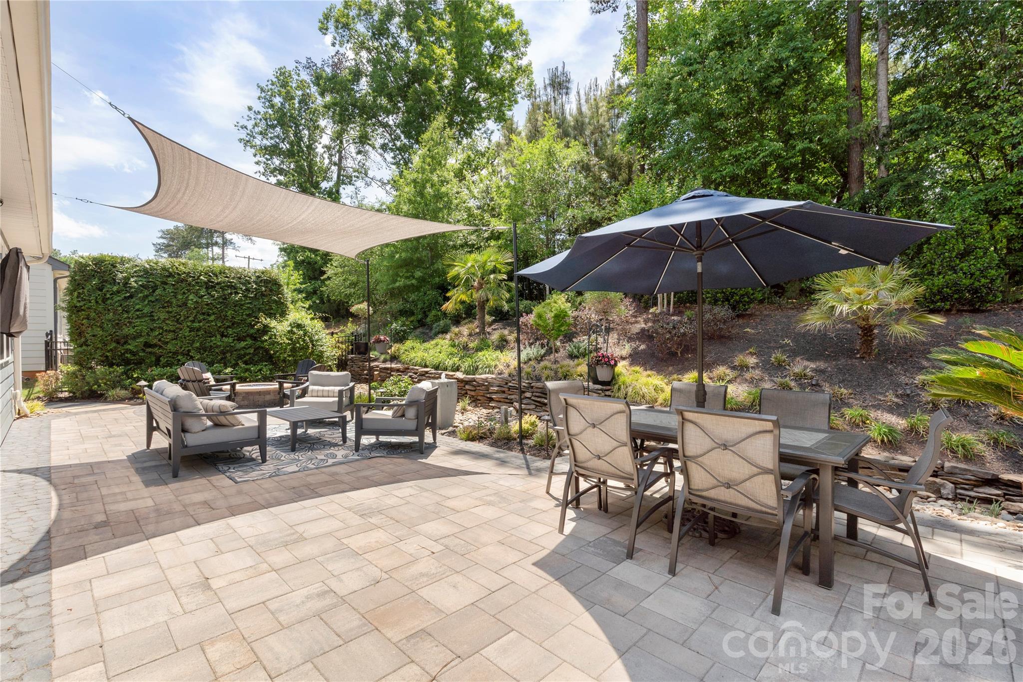 445 Sandbar Point Clover, SC 29710 - Photo 44 of 48 a view of patio with chairs and table under an umbrella