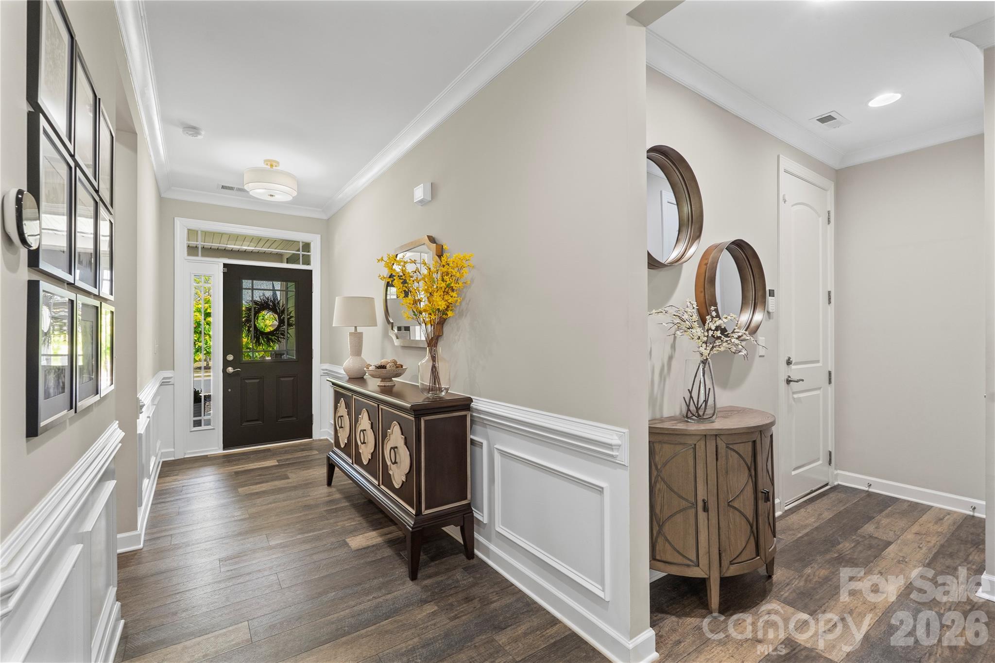445 Sandbar Point Clover, SC 29710 - Photo 7 of 48 a hallway with chandelier and wooden floor