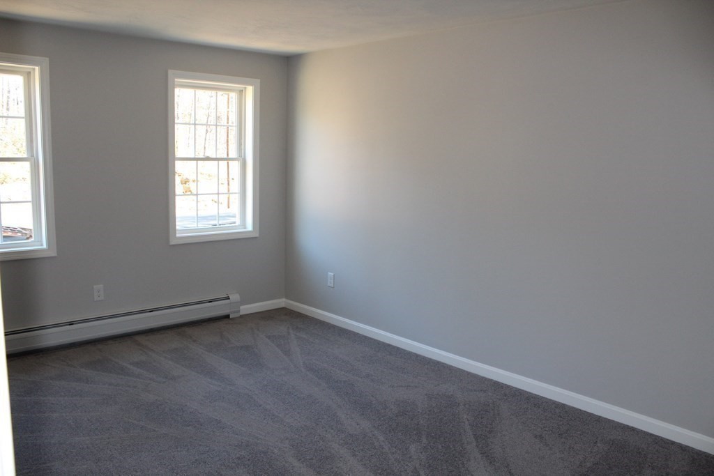 527 Old County Road Holland, MA 01521 - Photo 9 of 17 an empty room with a window