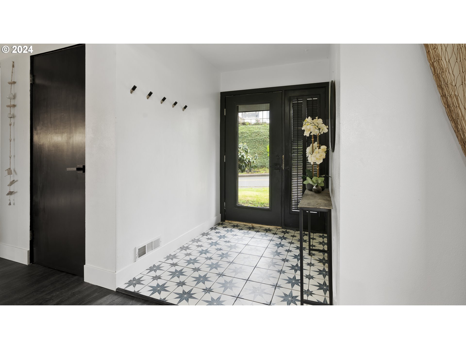 1160 North 10th Street Coos Bay, OR 97420 - Photo 9 of 42 a black and white photo of a bedroom