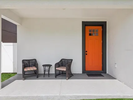 a view of room with windows and lounge chair