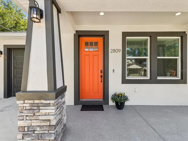 a view of an entryway with wooden door