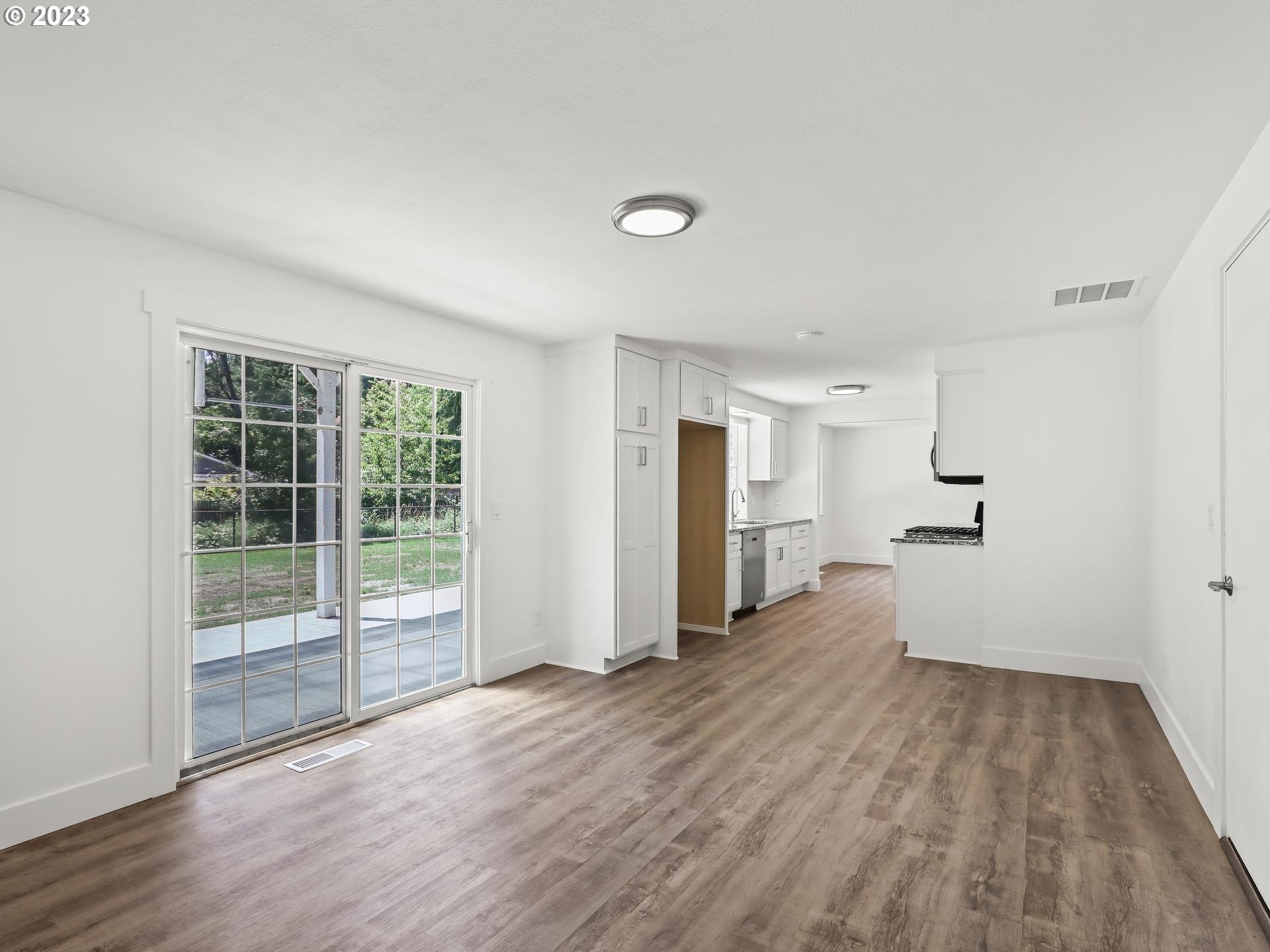 19650 Southwest Celebrity Street Beaverton, OR 97078 - Photo 14 of 47 a view of a room with wooden floor and stairs