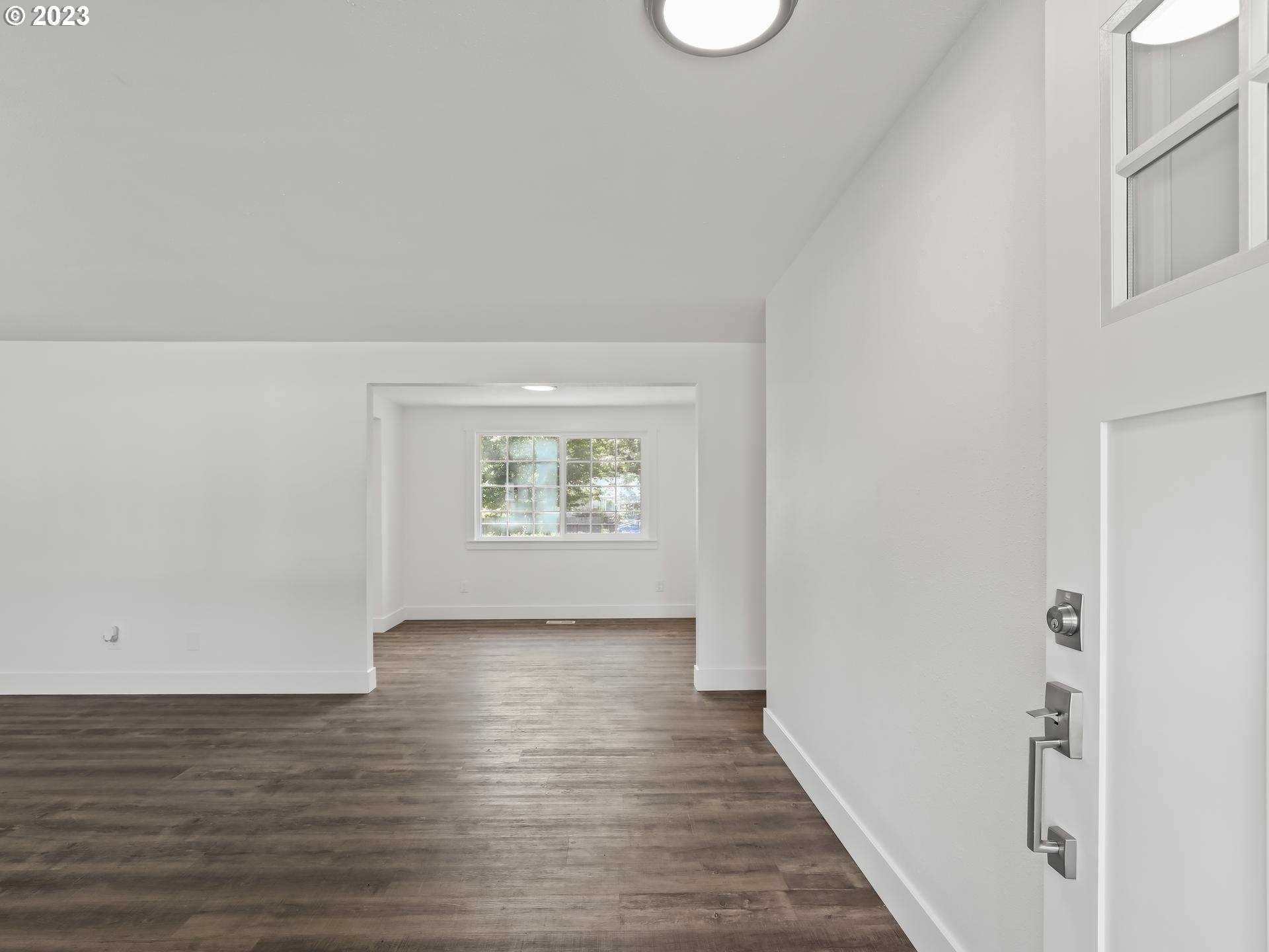19650 Southwest Celebrity Street Beaverton, OR 97078 - Photo 18 of 47 a view of an empty room with wooden floor and a window