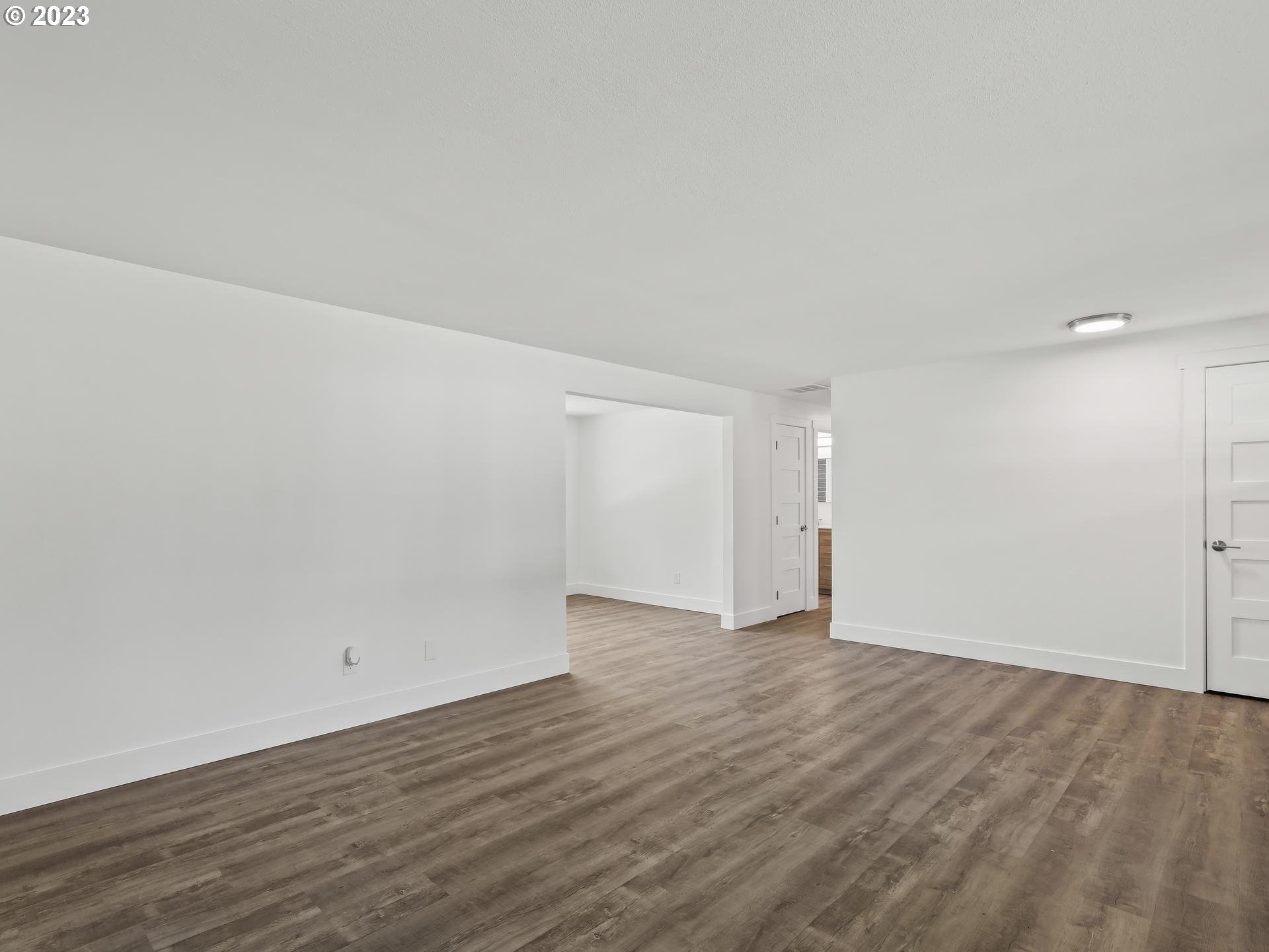 19650 Southwest Celebrity Street Beaverton, OR 97078 - Photo 19 of 47 a view of an empty room and wooden floor
