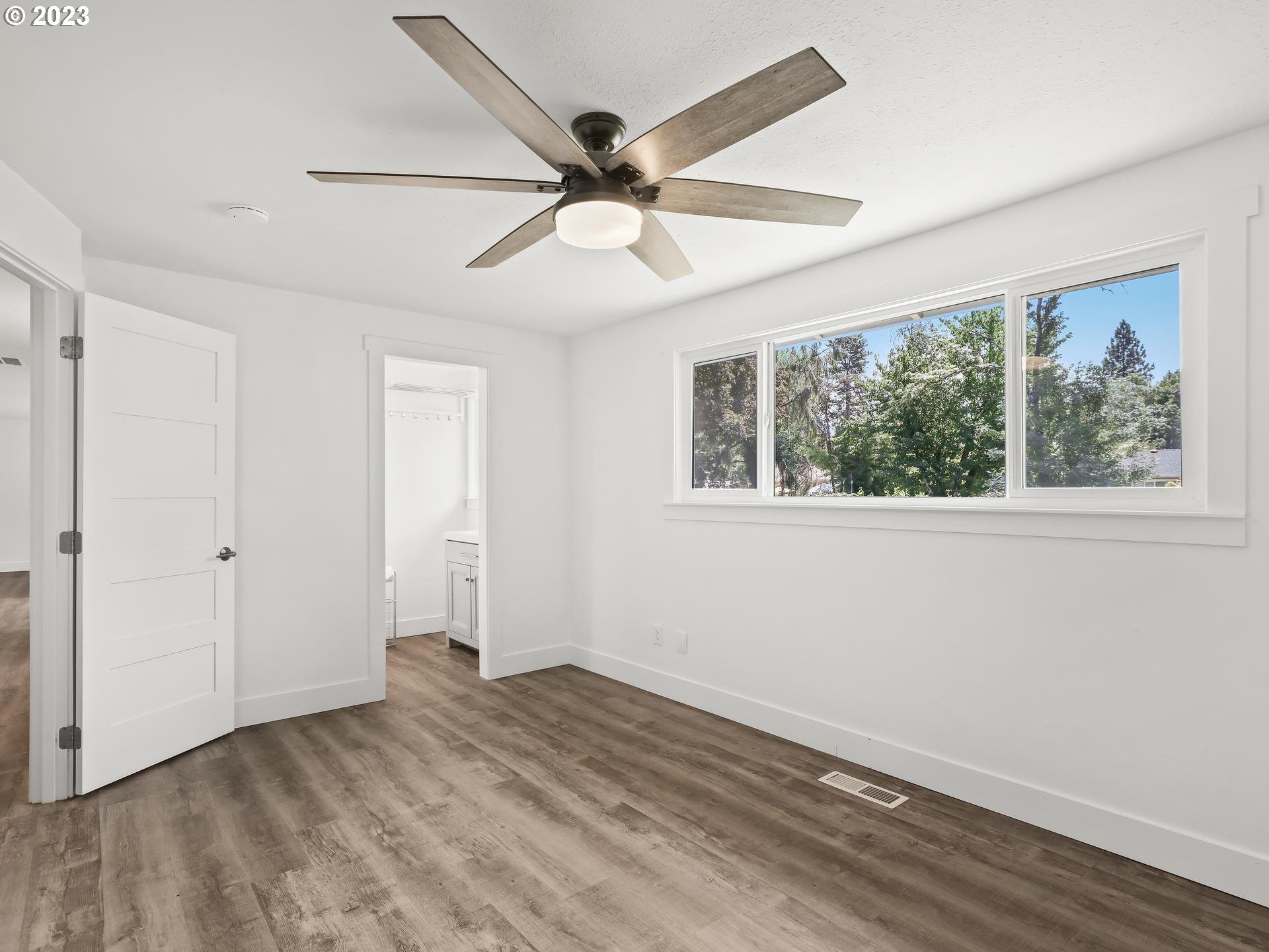 19650 Southwest Celebrity Street Beaverton, OR 97078 - Photo 22 of 47 a view of a big room with wooden floor and windows
