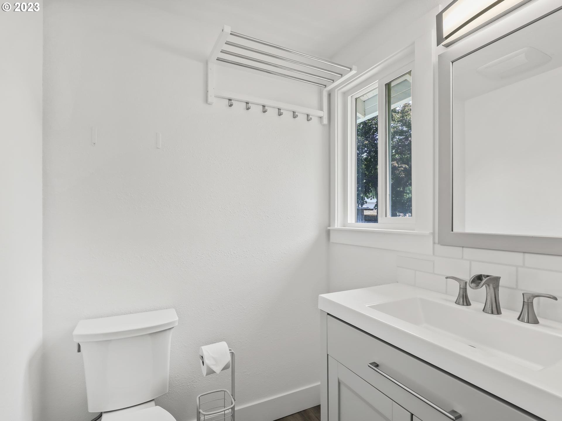 19650 Southwest Celebrity Street Beaverton, OR 97078 - Photo 24 of 47 a bathroom with a sink a toilet and a window
