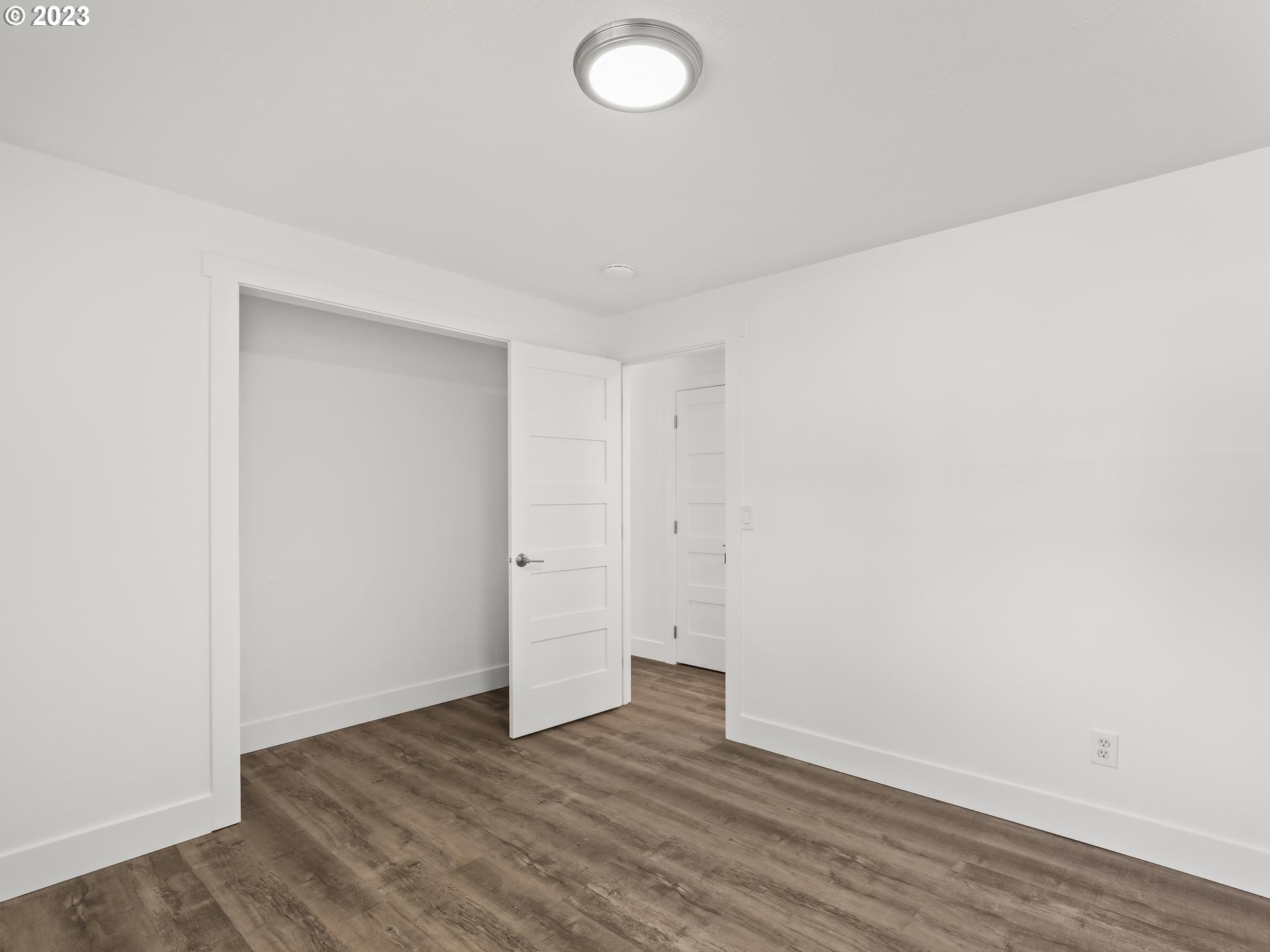 19650 Southwest Celebrity Street Beaverton, OR 97078 - Photo 28 of 47 a view of an empty room with wooden floor and a window
