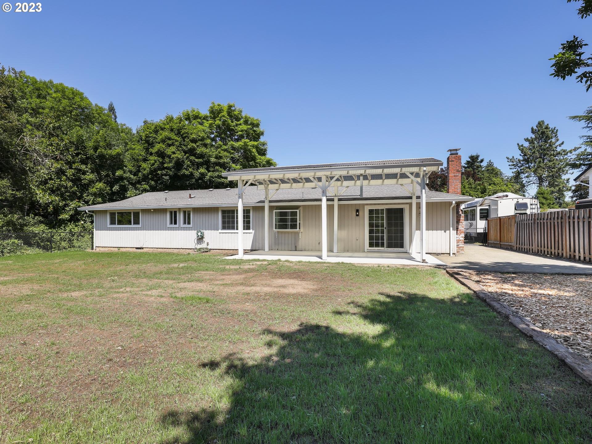 19650 Southwest Celebrity Street Beaverton, OR 97078 - Photo 31 of 47 a front view of a house with a garden