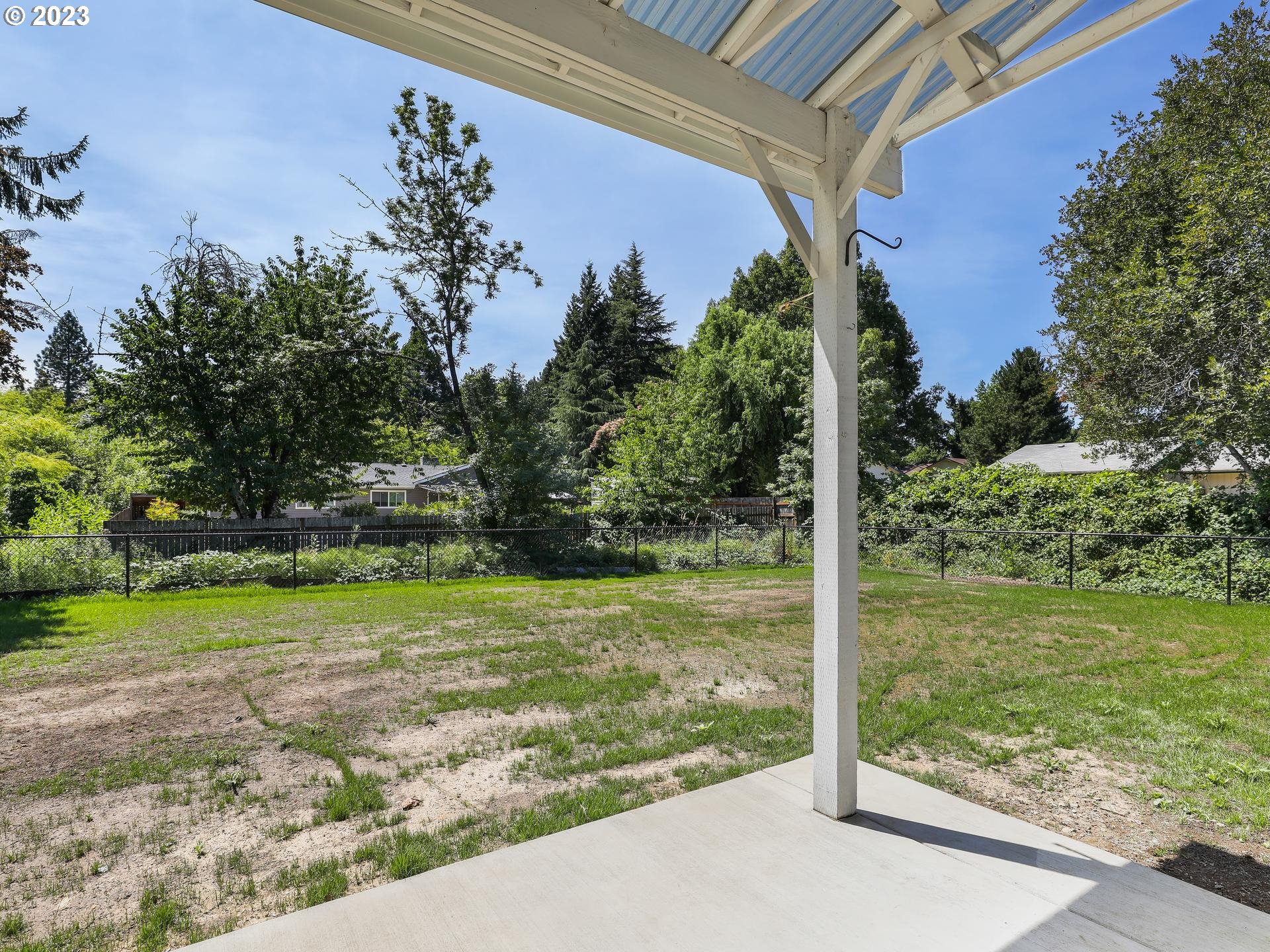 19650 Southwest Celebrity Street Beaverton, OR 97078 - Photo 34 of 47 a view of a backyard with large trees