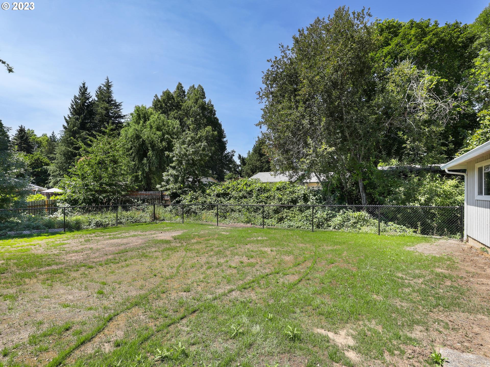19650 Southwest Celebrity Street Beaverton, OR 97078 - Photo 35 of 47 a view of a field with trees in the background