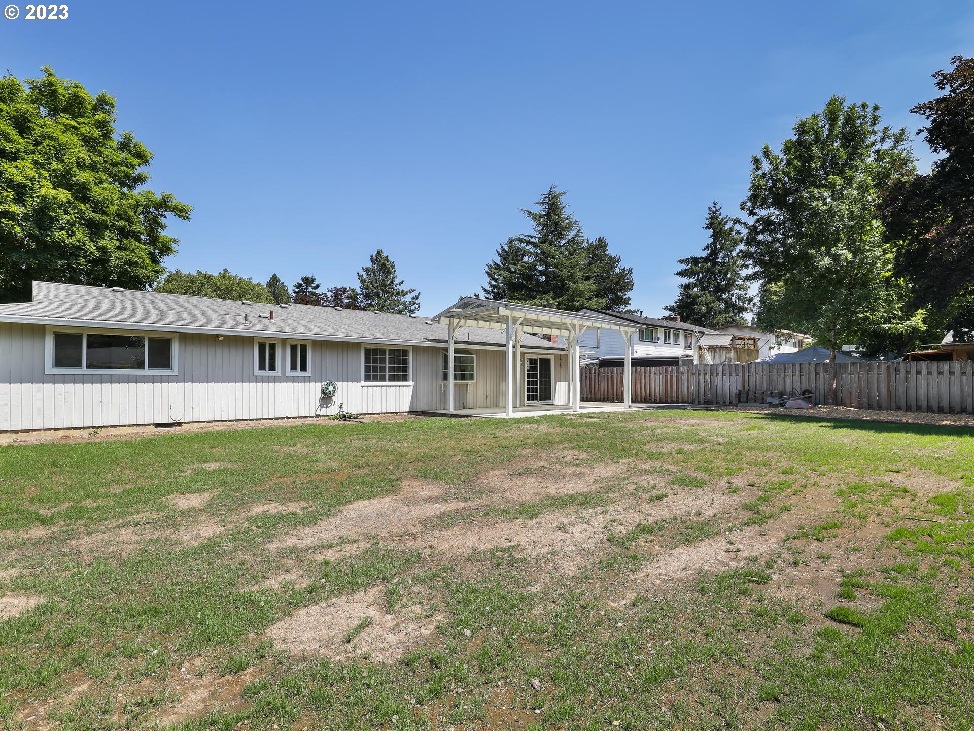 19650 Southwest Celebrity Street Beaverton, OR 97078 - Photo 37 of 47 a front view of a house with a garden