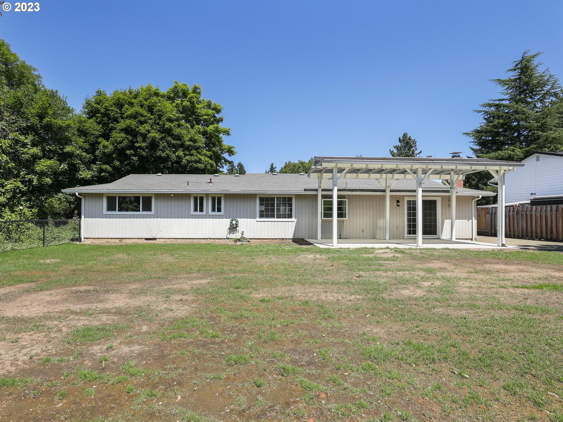 19650 Southwest Celebrity Street Beaverton, OR 97078 - Photo 38 of 47 a front view of a house with a garden