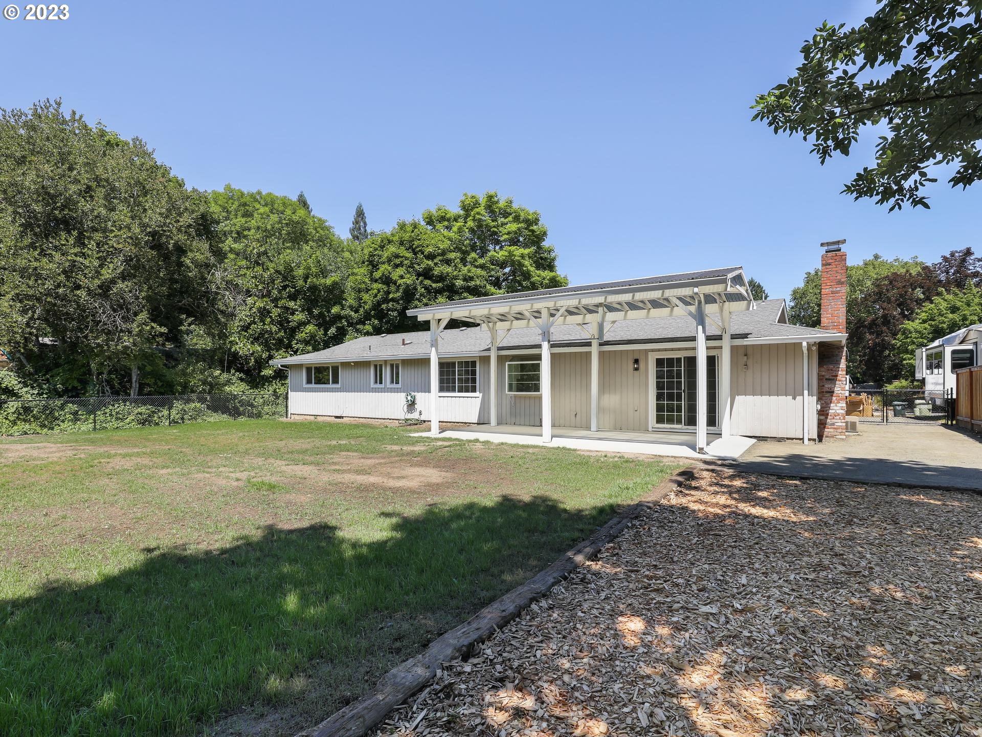 19650 Southwest Celebrity Street Beaverton, OR 97078 - Photo 39 of 47 a front view of a house with a garden