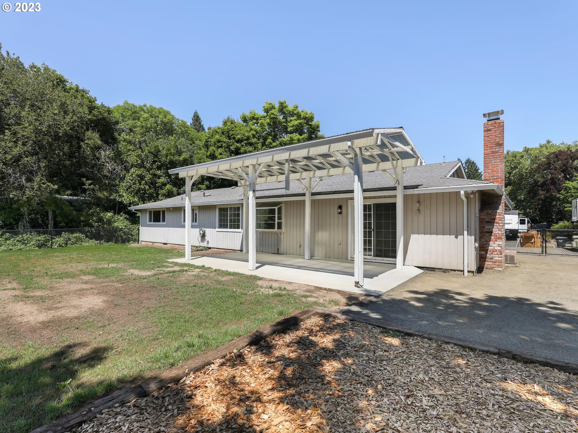 19650 Southwest Celebrity Street Beaverton, OR 97078 - Photo 40 of 47 a front view of a house with a garden