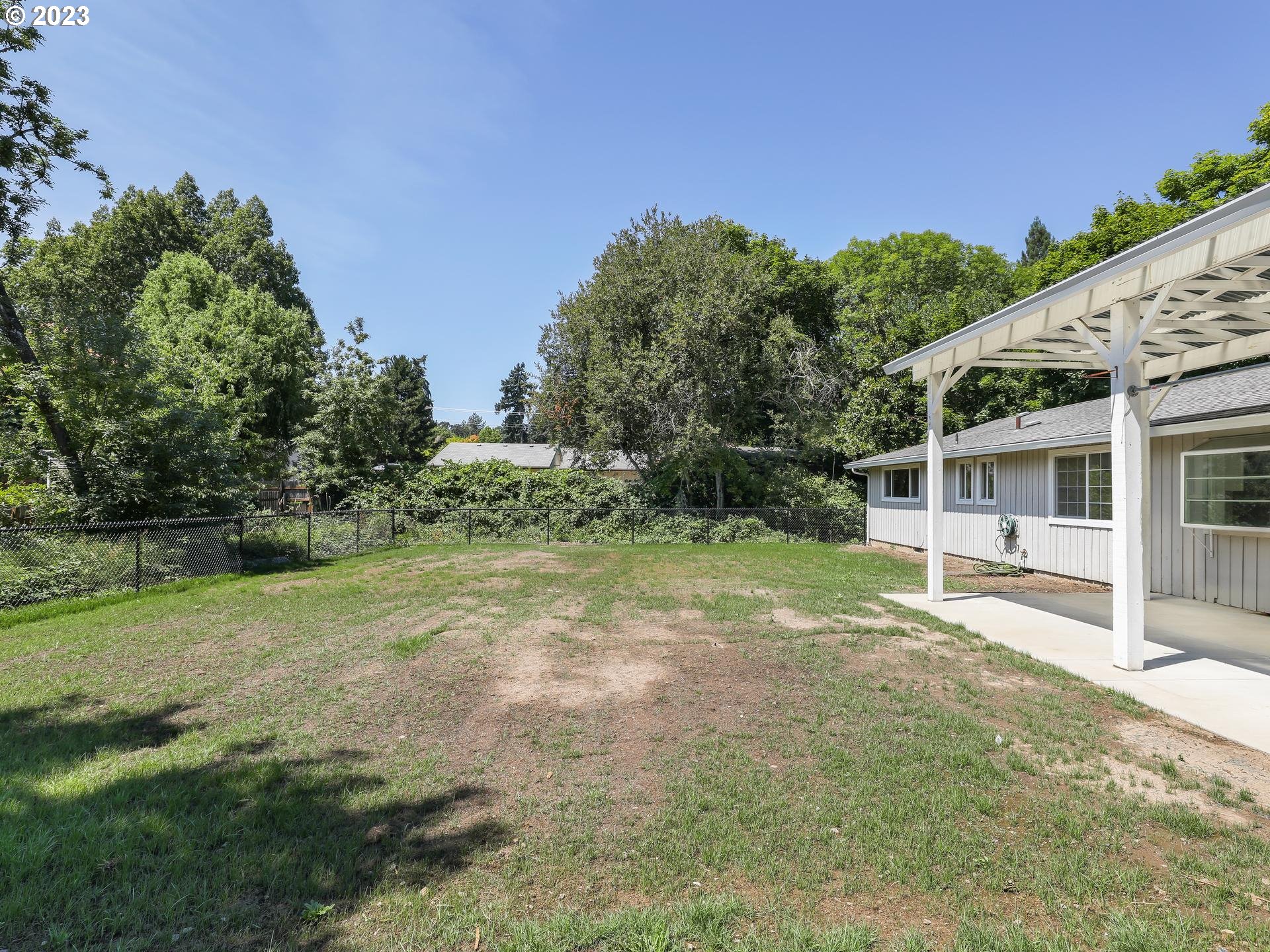 19650 Southwest Celebrity Street Beaverton, OR 97078 - Photo 41 of 47 a view of a house with backyard and a garden
