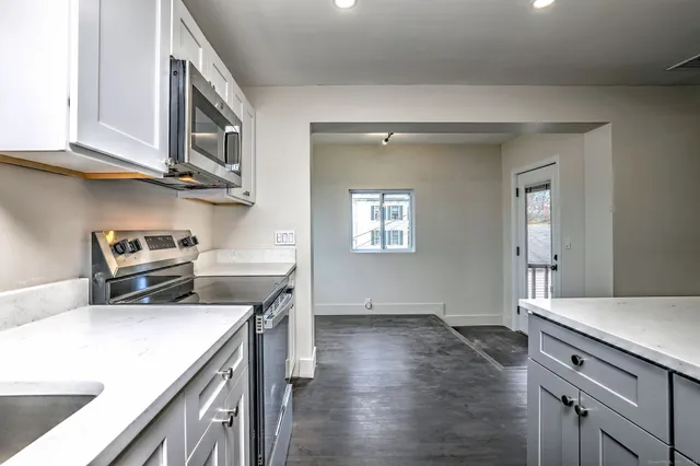 a kitchen that has a cabinets and a stove