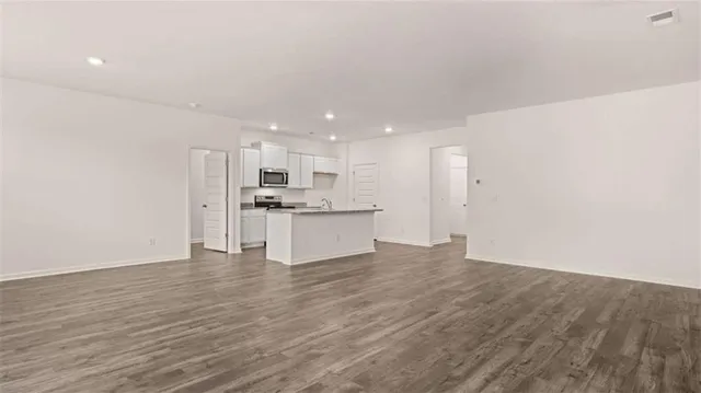 a view of kitchen with wooden floor