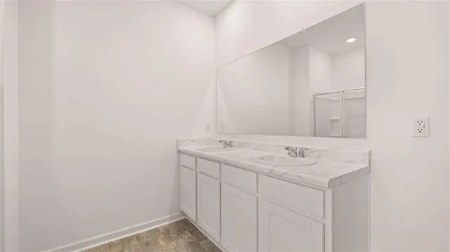 a bathroom with a sink and a mirror