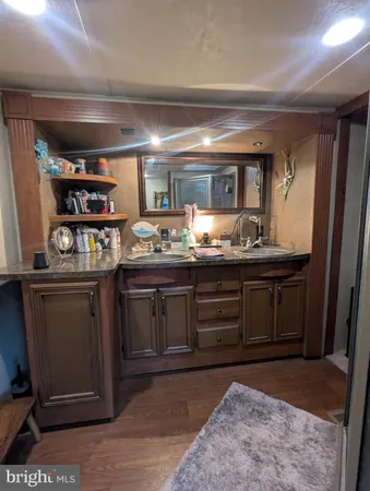 a large bed in a bedroom and a mirror