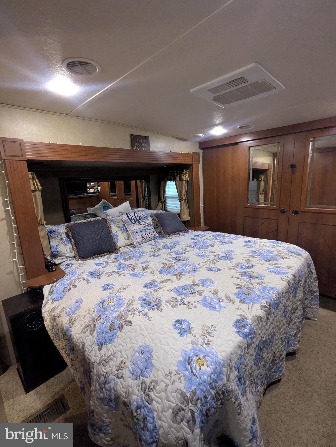 5 Bear Bottom Road Falling Waters, WV 25419 - Photo 13 of 27 a large bed in a bedroom and a mirror