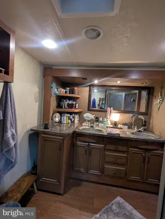 a kitchen with wooden cabinets and a stove top oven