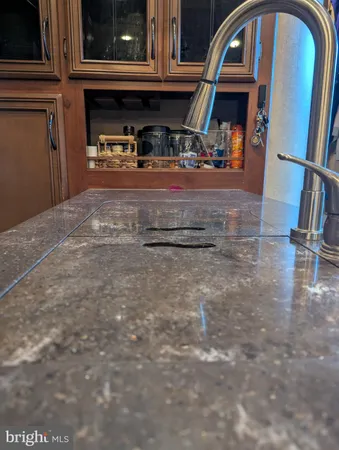 a bed sitting in a bedroom next to a larger window