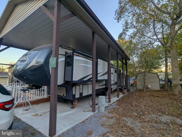 a large bed sitting in a bedroom next to a window