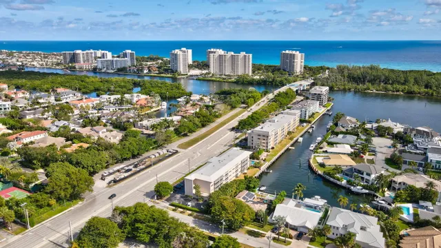 an aerial view of a house with a lake view