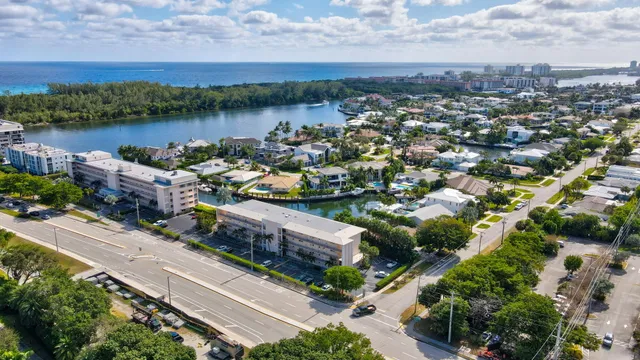 an aerial view of a house with lake view